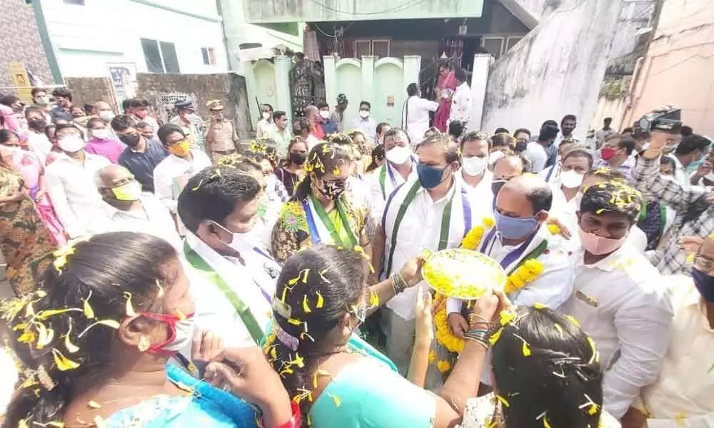 YSRCP leader S Sivarama Subramanyam and other activists during a visit to divisions in  Rajamahendravaram on Sunday
