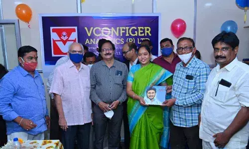 Home Minister Mekathoti Sucharita releasing a book on development with three capitals in Guntur on Sunday