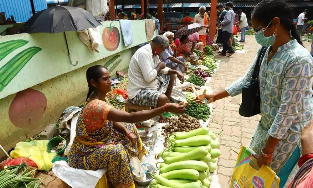 Vendors not wearing face masks while selling vegetables at Rythu Bazar in Tirupati