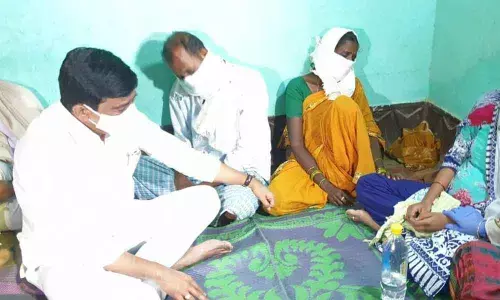 R&B Minister V Prashanth Reddy consoling the family members of Rada Mahesh at Komanpalli village on Monday