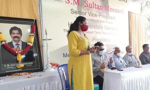 Athletic Federation of India executive member Hyma speaking at the condolence meeting held in the memory of TT administrator S M Sultan at the IGMC Stadium in Vijayawada on Monday