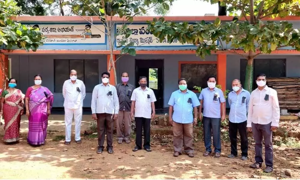 UTF Chittoor district president K Muthyala Reddy and other members taking part in a protest at Kuppambadur High School on Tuesday