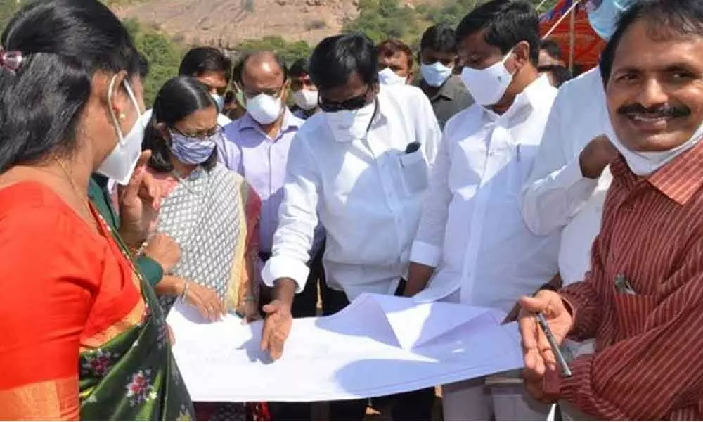 Ministers P Ajay Kumar and V Prasanth Reddy and Government Whip Gongidi Sunitha inspecting the site map