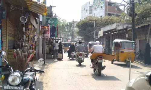 Land acquired for road facing encroachments