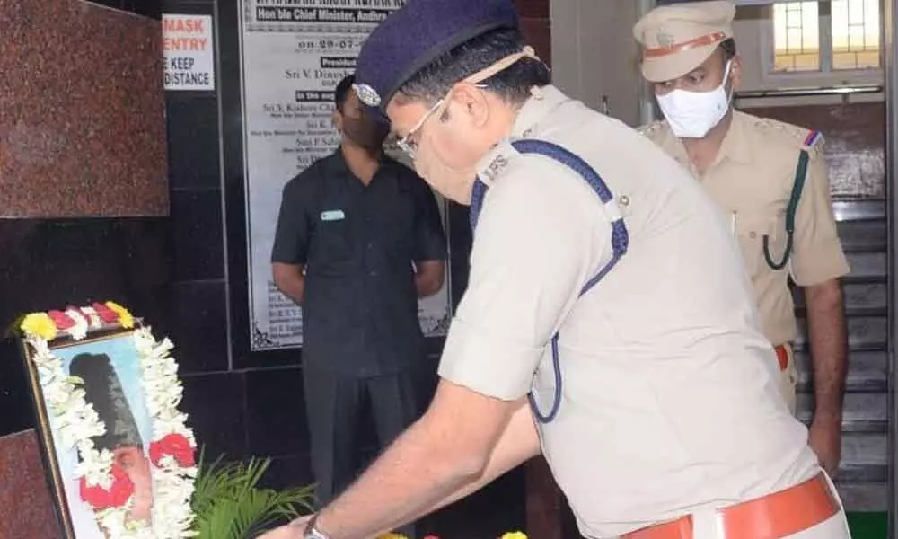 SP Amith Bardhar garlanding the portrait of Maulana Abul Kalam Azad on the occasion of his birth anniversary at the District Police Office in Srikakulam on Wednesday
