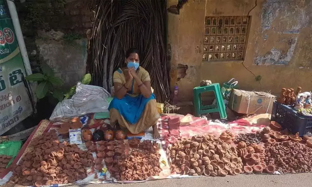 A vendor Surya Kumari waiting for customers in Kakinada on Wednesday