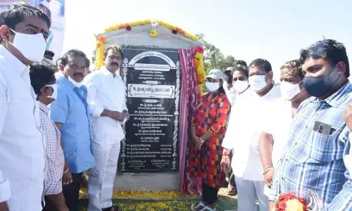 Minister Alla Kalikrishna Srinivas laying foundation stone for the construction of locks on the Krishna canal