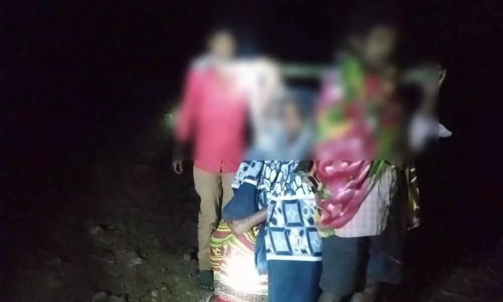 Tribal woman is carried during night to reach hospital
