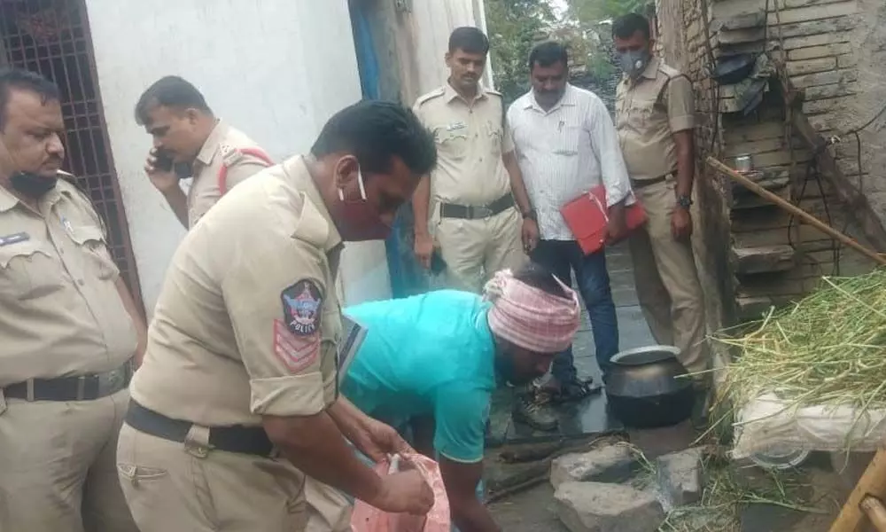 Police at the site at Chennampalli village in Owk mandal of Banaganapalle constituency in Kurnool district where a country-made bomb exploded on Sunday