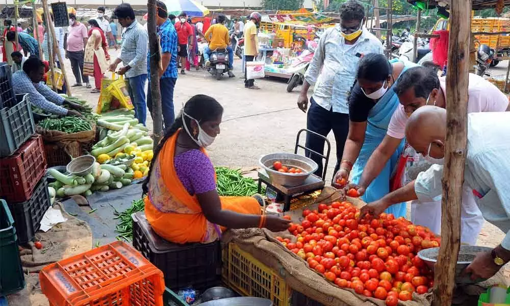 Consumers buying vegetables in Vijayawada on Sunday