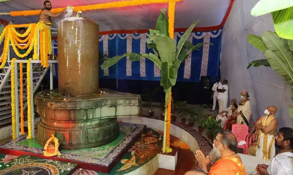 A priest performing Abhishekam to Siva Linga at Dhyanaramam located on the campus of  TTD-run Vedic University in Tirupati on the first Monday of the auspicious Karthika Masam