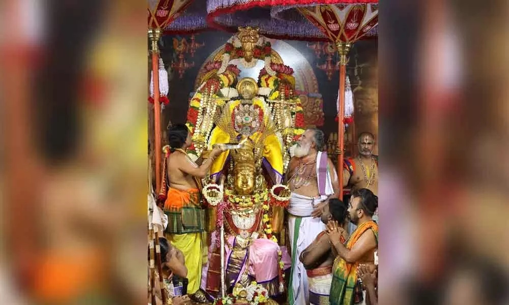 Goddess Padmavathi giving darshan to devotees from atop Garuda Vahanam at Tiruchanoor on Monday