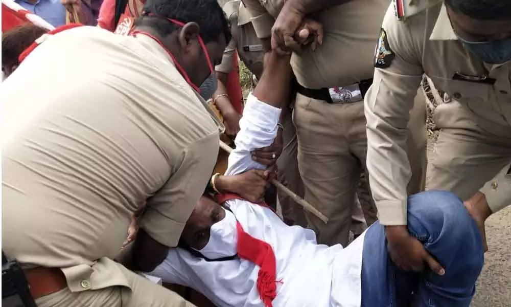 Police arresting a CPI leader in Rajamahendravaram on Monday