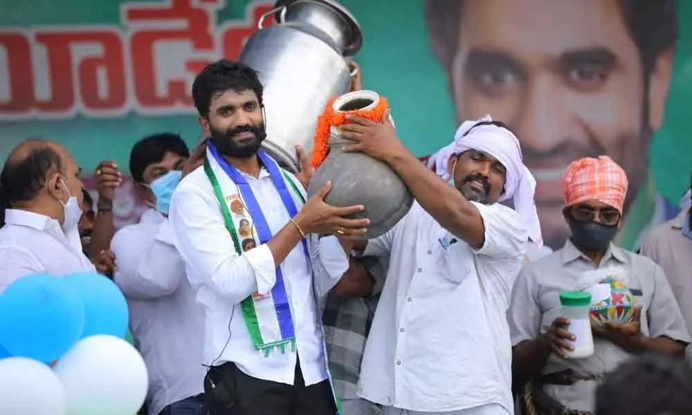 MP Margani Bharat Ram carrying milk can in Padayatra in Rajamahendravaram on Monday