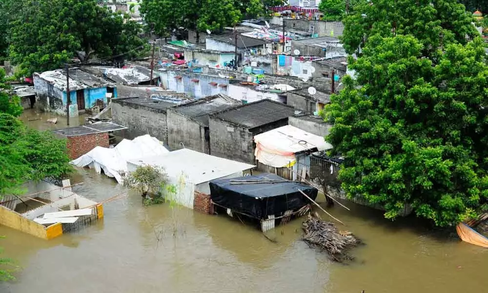 Colonies on riverbed inundated in floods (File photos)