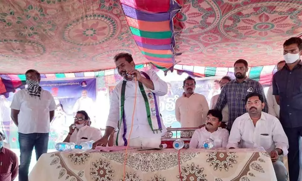 Jaggampeta MLA Jyothula Chantibabu addressing people at Achyutapuram on Tuesday