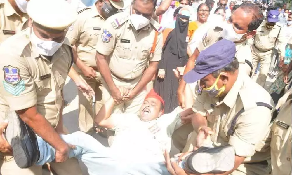 Police arresting a CPM leader, who was trying to lay siege to the Corporation office in Khammam on Wednesday