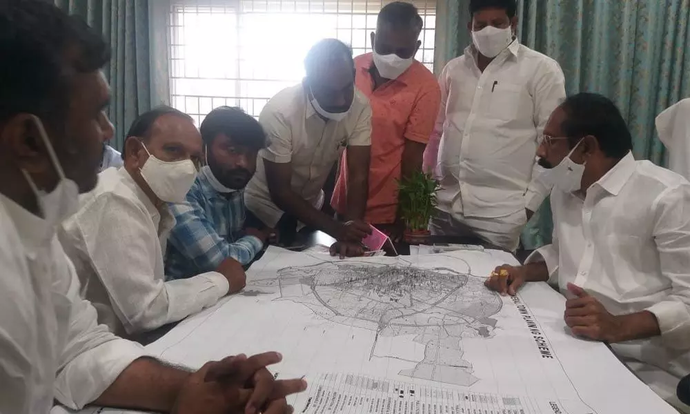 SUDA Chairman Bachu Vijay Kumar watching the Master Plan of development with directors and officers at a meeting in Khammam