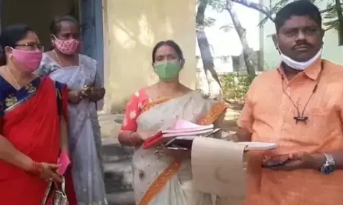 Tahsildar Parthasaradhi during the setting up of paddy procurement centres in Mahbubnagar on Friday