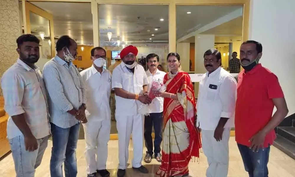 MLA Banoth Haripriya congratulating Sardar Ravinder Singh on his election as the chairman of Telangana Yoga Association