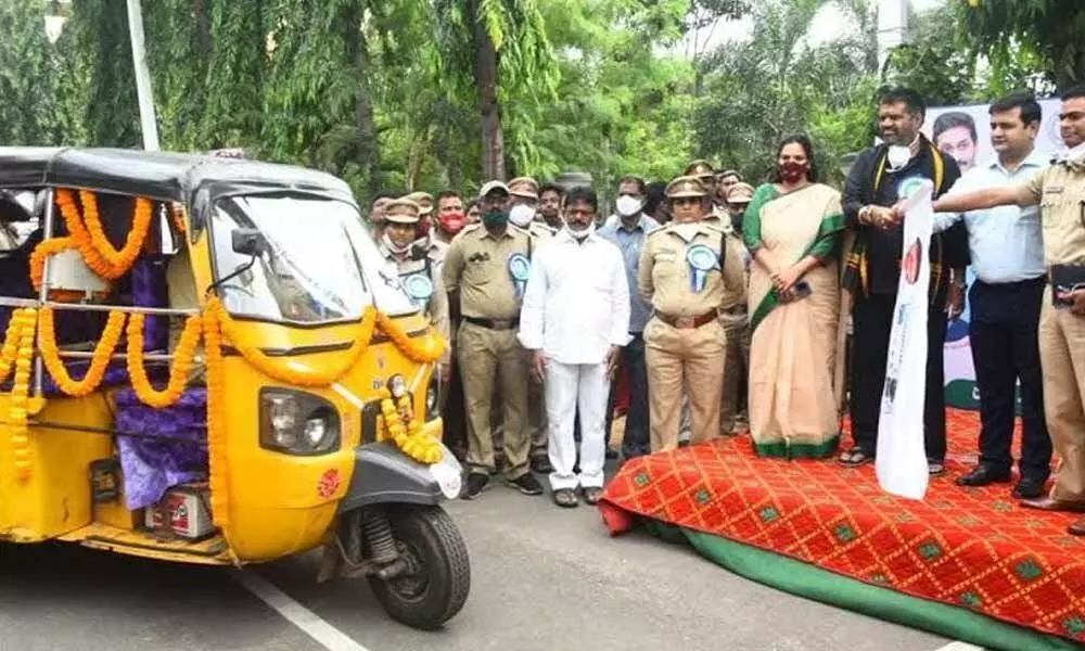 Minister M Srinivasa Rao and District Collector V Vinay Chand inaugurating an IoT-equipped auto-rickshaw in Visakhapatnam  on Monday