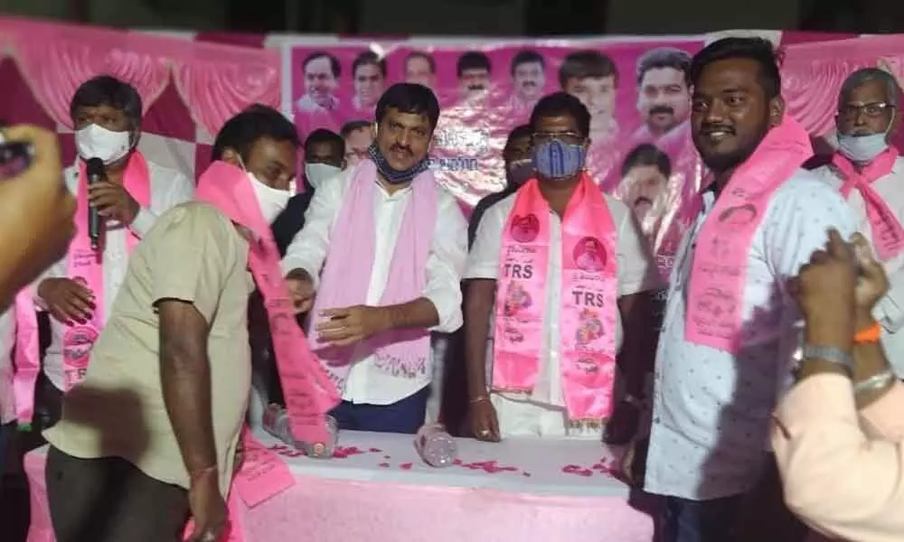 Former MP and TRS leader Ponguleti Srinivas Reddy welcoming a leader into the TRS party in Hyderabad on Monday