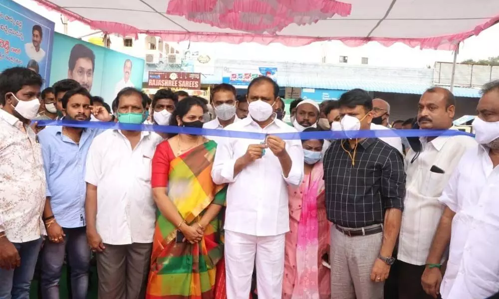 MLA B Karunakar Reddy inaugurating the new vegetable market in Tirupati on Monday. Commissioner P S Girisha is also seen