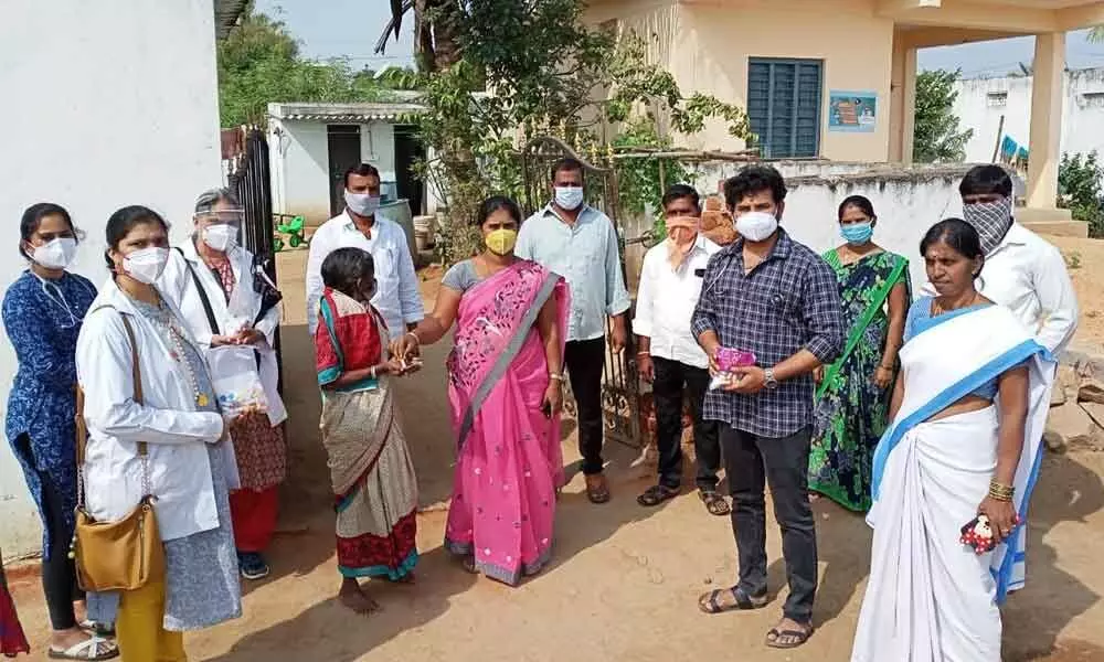 JIMS Homeopathic Medical Hospital doctors distributing immunity booster medicines in Venkammaguda village on Monday