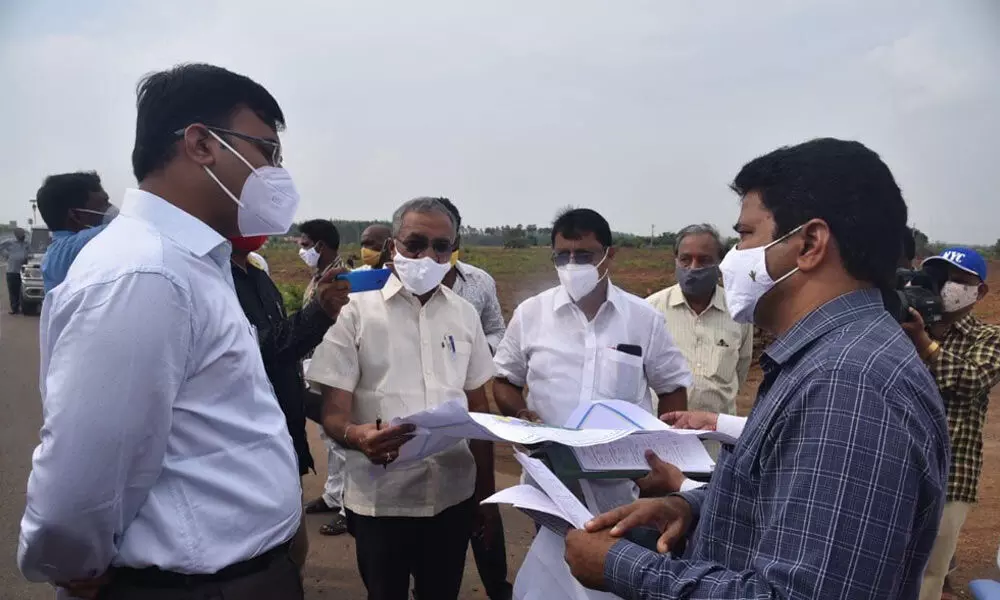 District Collector K V N Chakradhar Babu interacting with the officials at the Greenfield Airport site in Dagadarthi near Nellore on Monday