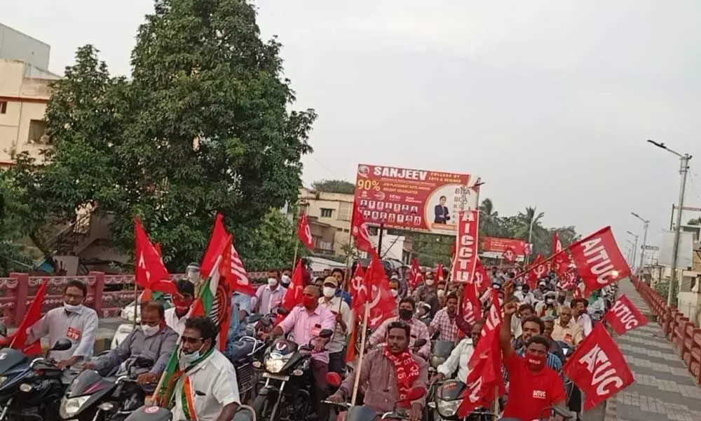 Leaders and activists of Left parties taking out a bike rally in Kakinada on Tuesday