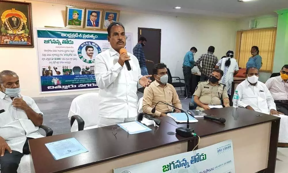 MLA A Srinivasulu addressing a meeting at Municipal Corporation office in Chittoor on Wednesday. Civic chief P Viswanath is also seen
