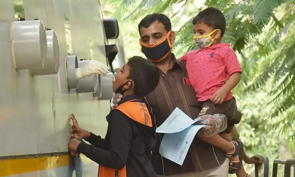 A boy getting tested for coronavirus at Sanjeevani bus at ENT Government Hospital in Visakhapatnam on Wednesday