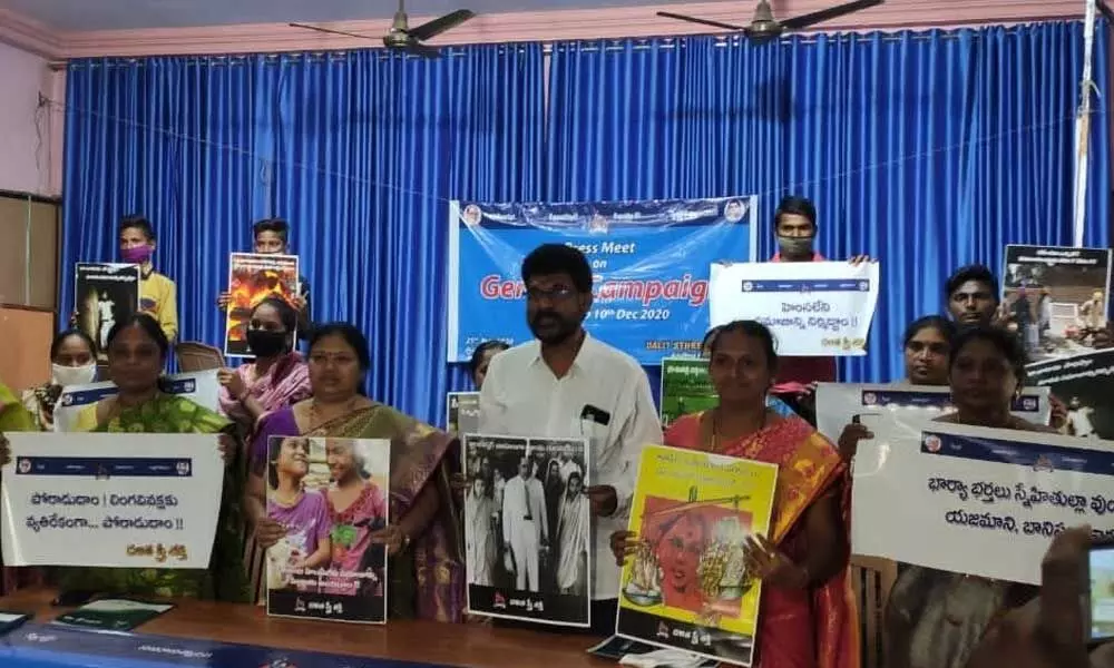 Dalit Sthree Sakthi national convener Geddam Jhansi releasing posters on gender equality along with other activists in Vijayawada on Wednesday