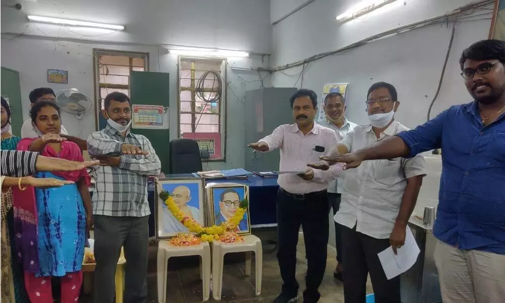 DPO GV Narayana Reddy and his office staff taking Constitution Day pledge on Thursday