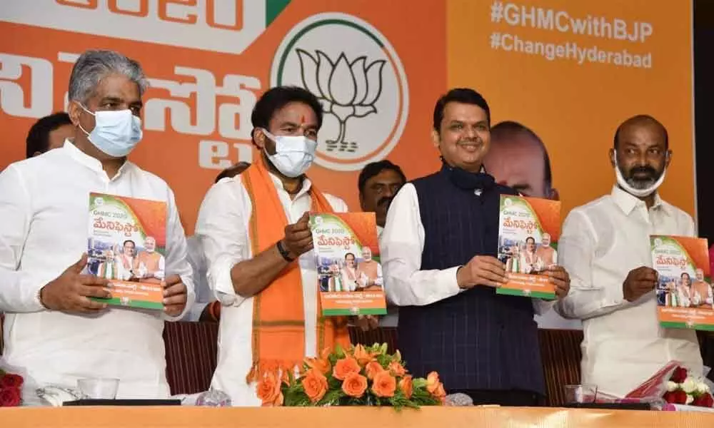 Former Chief Minister of Maharashtra Devendra Fadnavis releasing BJP manifesto for GHMC election in Hyderabad on Thursday