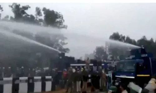 Braving tear-gas shells, water cannons, thousands break barricades in Haryana