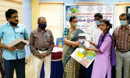 APCOST member secretary Dr Y Aparna presenting prize to a winner of drawing contest on Thursday