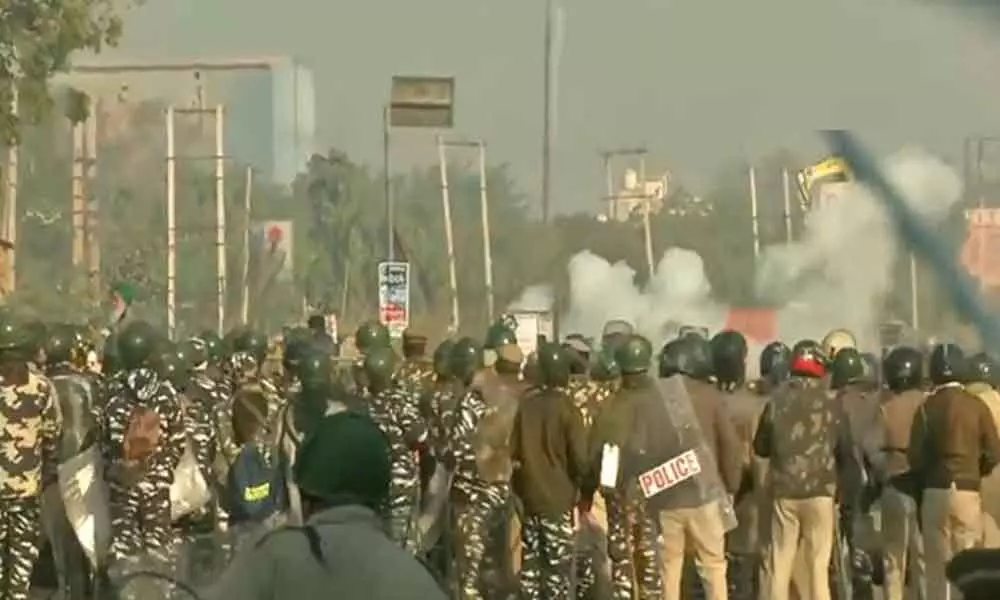 Farmers protest: Delhi Police fire tear gas shells to disperse farmers at Singhu border