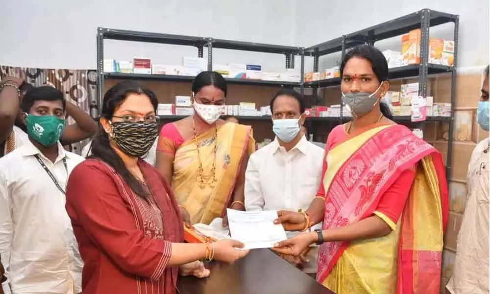Municipal Commissioner Pamela Satpathy giving order copy to one of the transgender in Warangal on Friday