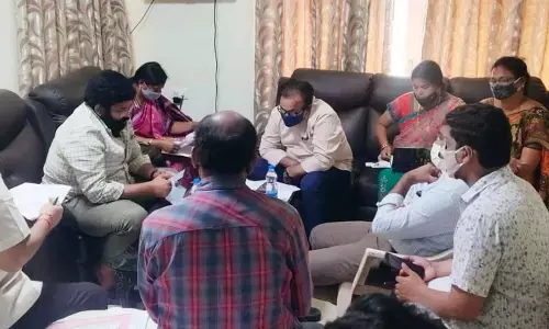 Rajanagaram MLA Jakkampudi Raja reviewing progress of works with officials in Rajamahendravaram on Friday