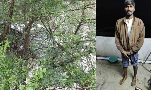 The car that swept way in the stream and up in the woods; Thotakura Rajesh at his home in the early hours of Friday