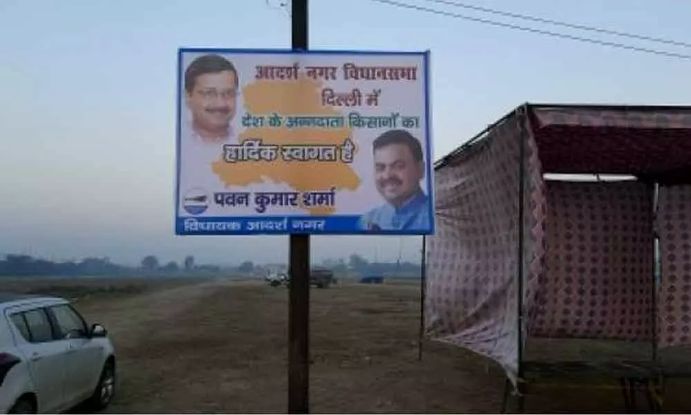 AAPs welcome banners come up as farmers camp at Burari ground