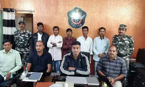 Chintapalli ASP Vidhyasagar Naidu producing the surrendered militia members before the media on Saturday