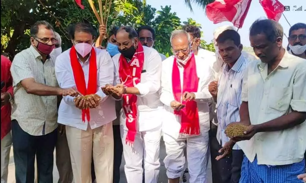 CPI State secretary K Ramakrishna and other leaders visiting a crop damaged village in West Godavari district on Sunday