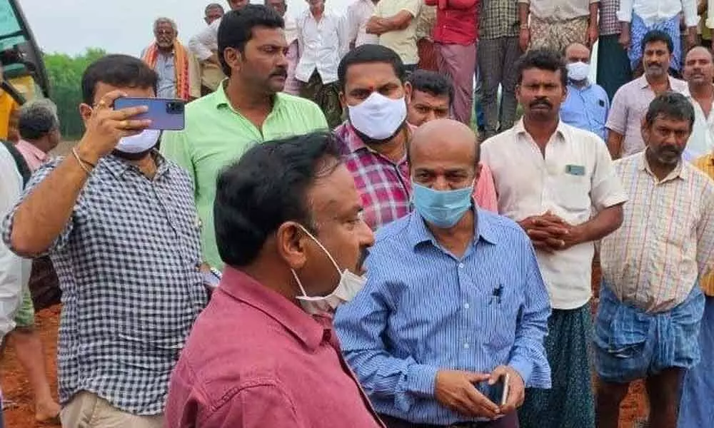 Prakasam district Collector Dr Pola Bhaskara inspecting the repair works of minor irrigation tank at Konijedu on Sunday