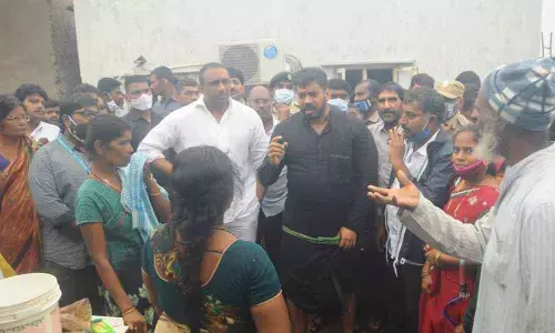 Ministers Anil Kumar Yadav and Goutham Reddy interacting with the flood-hit victims at Bhagat Singh Colony in Nellore on Sunday