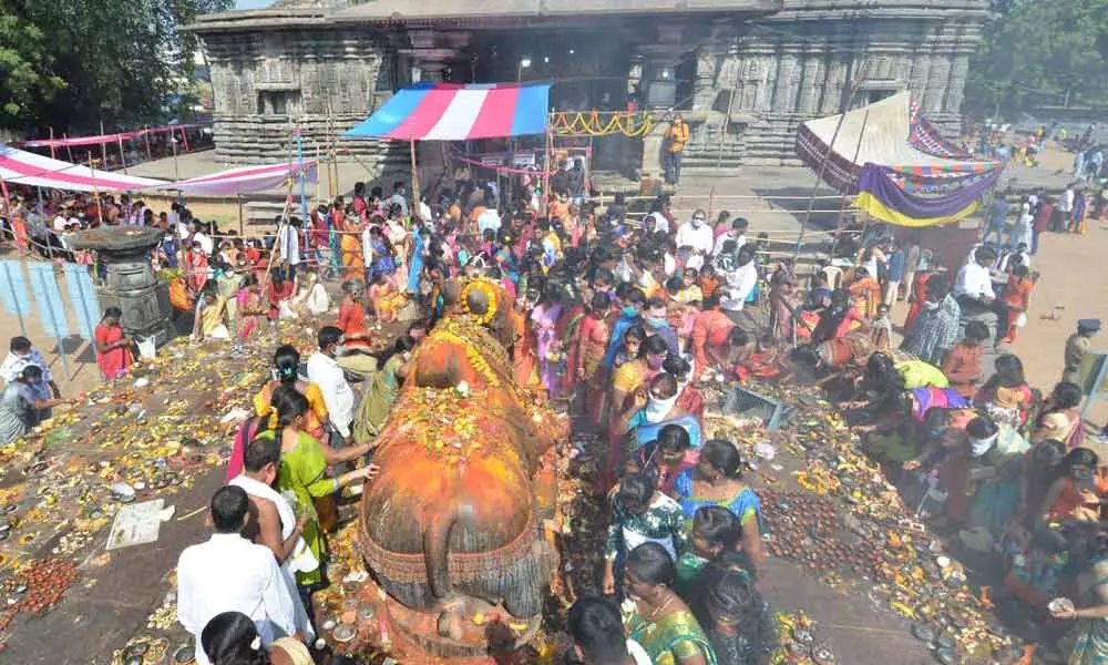 Devotees lighting diyas on the premises of 1000 Pillars temple in Hanamkonda on Monday