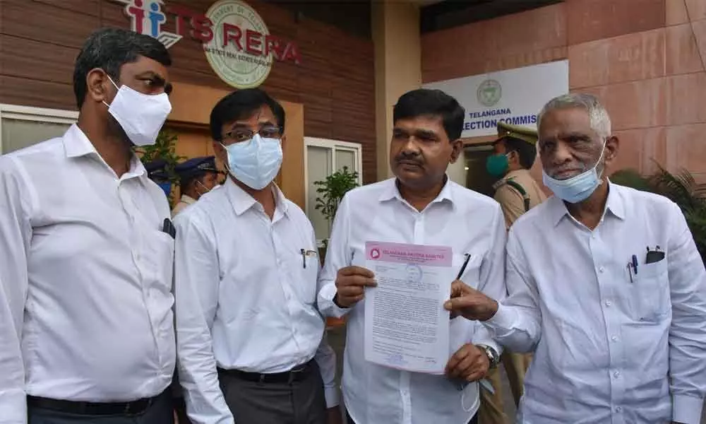 TRS party general secretaries  M Srinivas Rao and Bharat Kumar Soma and others coming out of the office of State Election Commission after submitting a complaint against a local news channel
