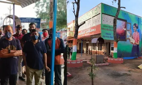 Collector M Hari Jawaharlal and other officials visiting a renovated Municipal Primary School at Kothapeta in Vizianagaram town