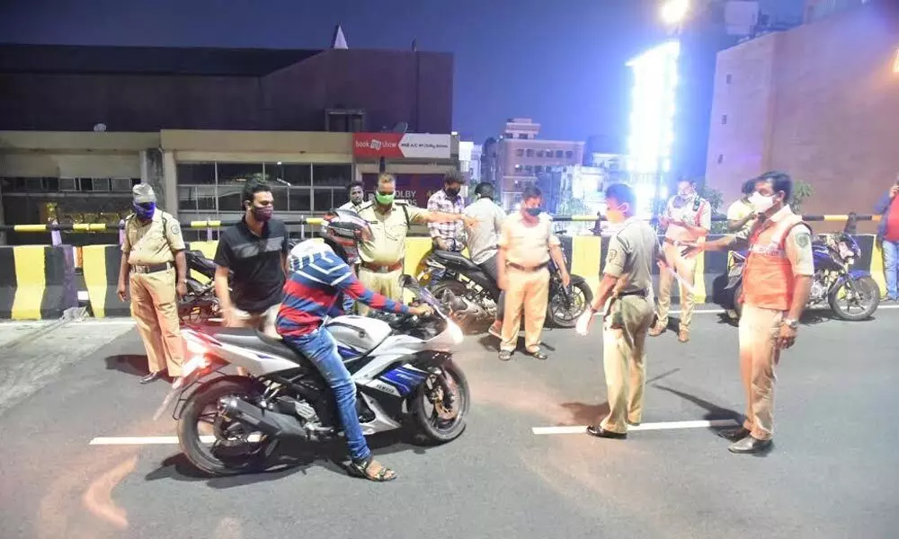 Police stopping a two-wheeler rider for exceeding the speed limit in Visakhapatnam